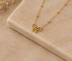 Minimalist High-Polish Bow Motif Pendant | MPS & Co.